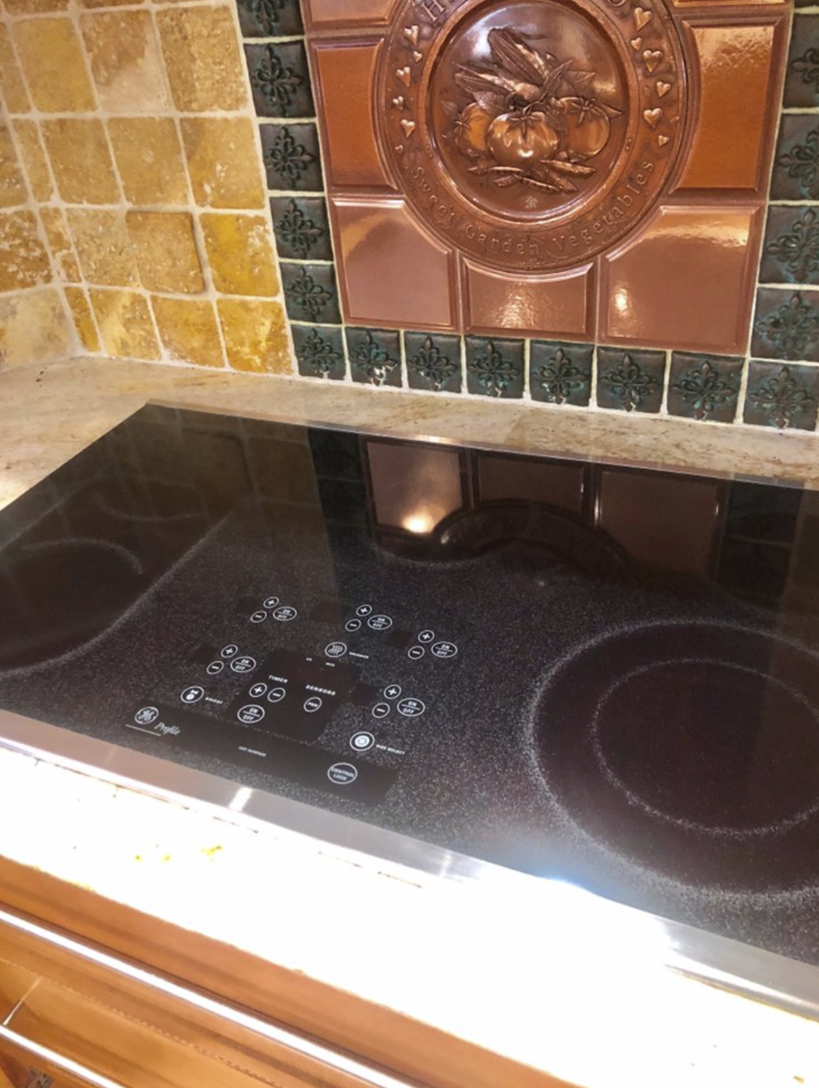 GE Profile glass cooktop service in Long Island kitchen