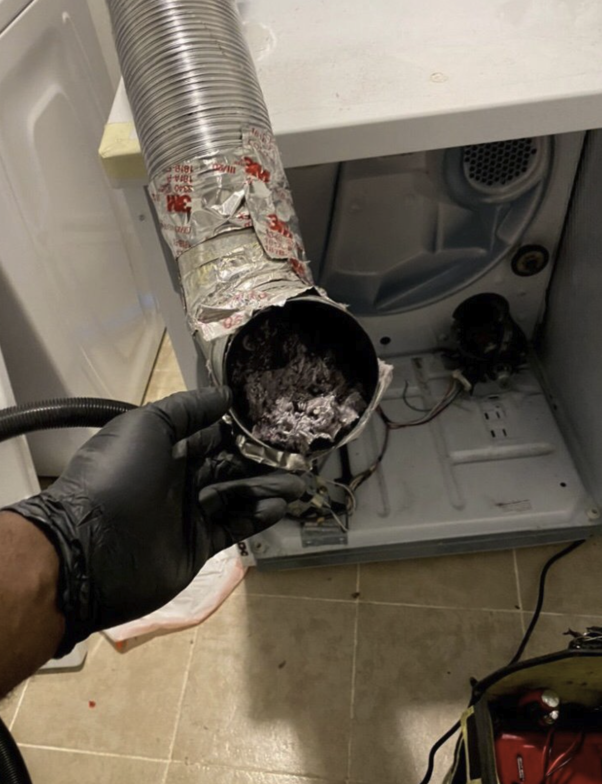 Dryer vent service and cleaning — clogged duct removed